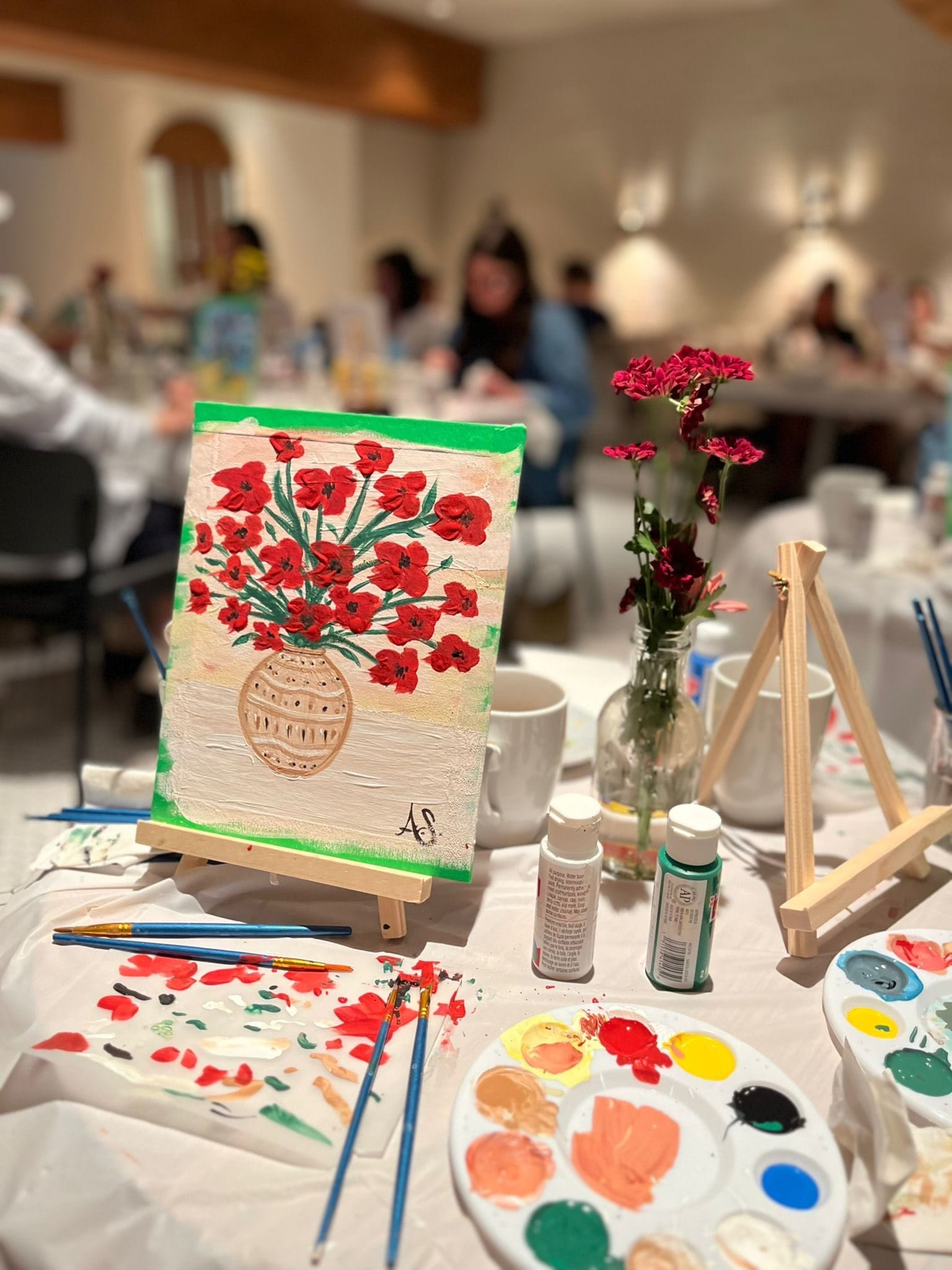 A pink poster for the event "Facing Canada's Complicity: Palestine and the Arts" showing an image of Palestine and the words "from the river to the sea...and the whole world is watching..." as well as event details.